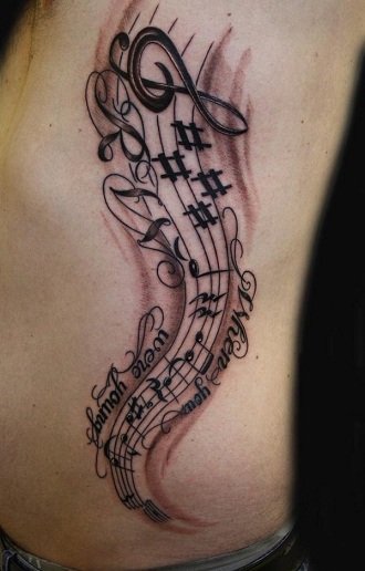 Muzikos užrašų tatuiruotės