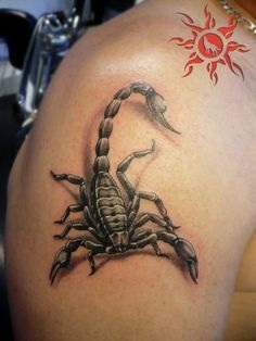 Saulės skorpiono tatuiruotė ant rankos