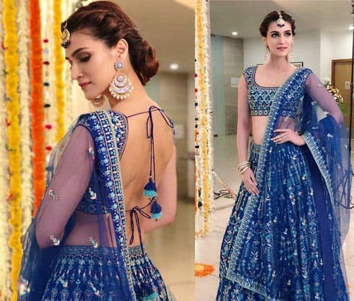 Düğün için lehenga üzerinde topuz saç modeli