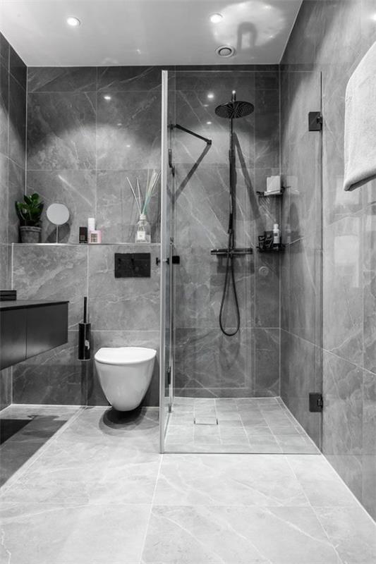 Σχέδια μπάνιου σε γκρι όμορφο μοντέρνο μπάνιο γκρι μαρμάρινα πλακάκια μαύρα εξαρτήματα μπάνιου ενσωματωμένο ελαφρύ γυάλινο τοίχο