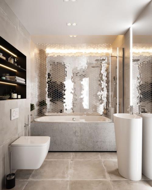 Τα πλακάκια στο μπάνιο σχεδιάζουν δημιουργικά και τολμηρά έναν τοίχο με ανακλαστικά πλακάκια και θαυμάζουν το εφέ λάμψης