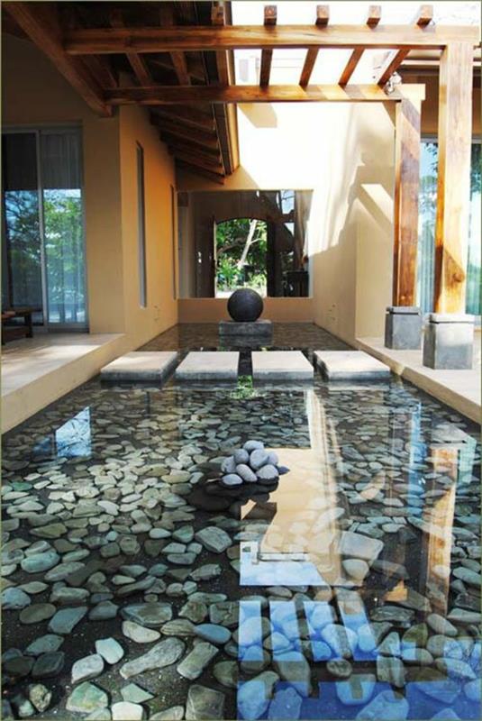 Εικόνες λίμνης κήπου Ιαπωνικό σχέδιο κήπου με πέτρες και νερό