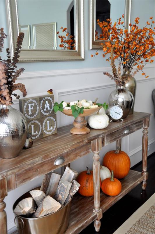 Κονσόλα τραπέζι φθινοπωρινή διακόσμηση vintage στυλ κολοκύθες βάζα μπολ με φύλλα φθινοπώρου Κάδος με καυσόξυλα