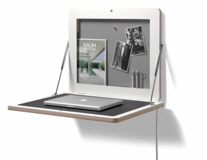Στήστε ένα μικρό γραφείο στο σπίτι στον τοίχο με ένα τραπέζι φορητού υπολογιστή