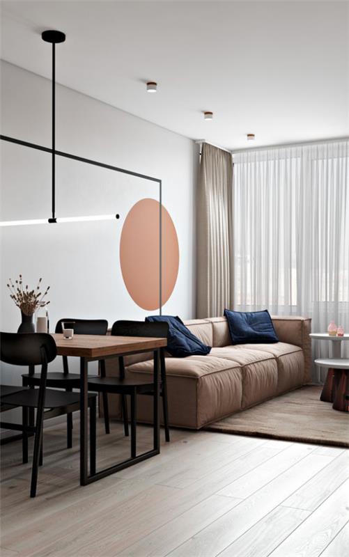 Περισσότερο χρώμα στο εσωτερικό, κομψό καθιστικό στον υπαίθριο χώρο Dab στον τοίχο, ζεστός πορτοκαλί καναπές σε ανοιχτό καφέ, κομψή σχεδίαση