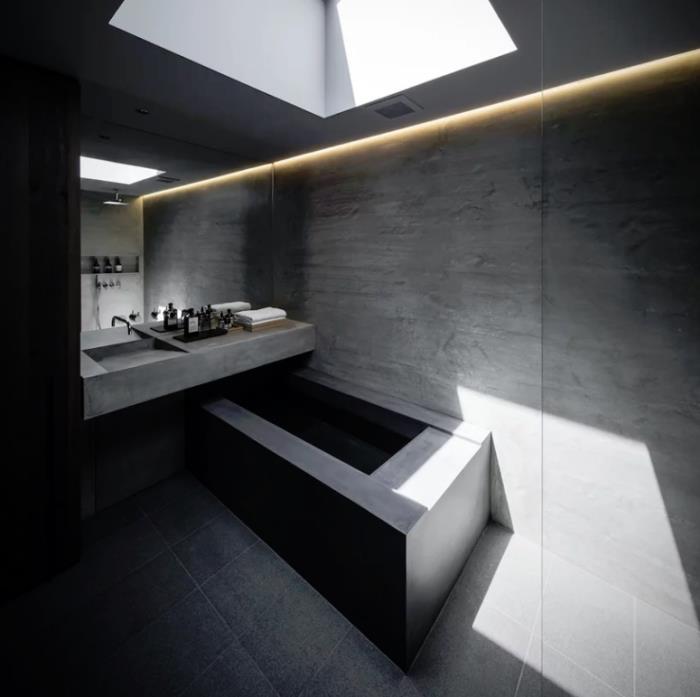 Μινιμαλιστικό πέτρινο και τσιμεντένιο σπίτι στην Ιαπωνία Καθαρός μινιμαλισμός στο εσωτερικό του μπάνιου υπερ-μινιμαλιστική μπανιέρα από τσιμέντο ενσωματωμένα φώτα LED