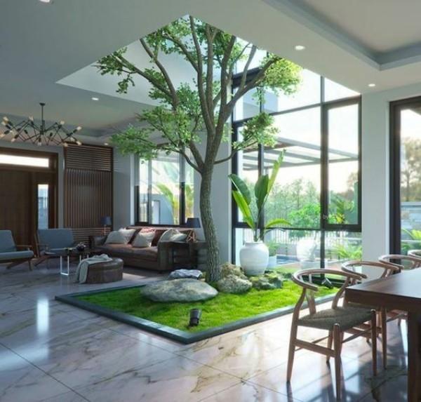 Ένα δέντρο φέρνει τη φύση στο σπίτι και ανθίζει στη μέση του δωματίου