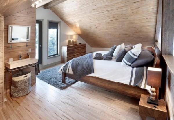 Υπνοδωμάτιο κάτω από επικλινή ζεστά χρώματα μπεζ πολλά ξύλινα καναδικά ονειρεμένα σπίτια