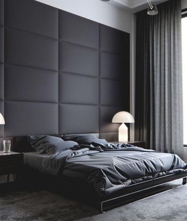 Κομψό υπνοδωμάτιο με μαύρο τοίχο και μαύρο δερμάτινο τοίχο με έμφαση πίσω από το κρεβάτι ύπνου γκρι κουρτίνες κλινοσκεπάσματα γκρι χαλί
