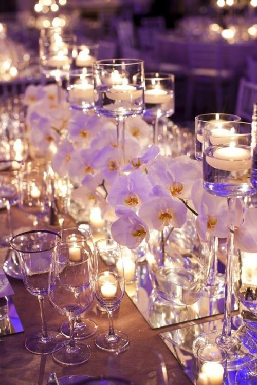 Διακόσμηση τραπεζιού με κεριά ορχιδέας λευκά λουλούδια ορχιδέας