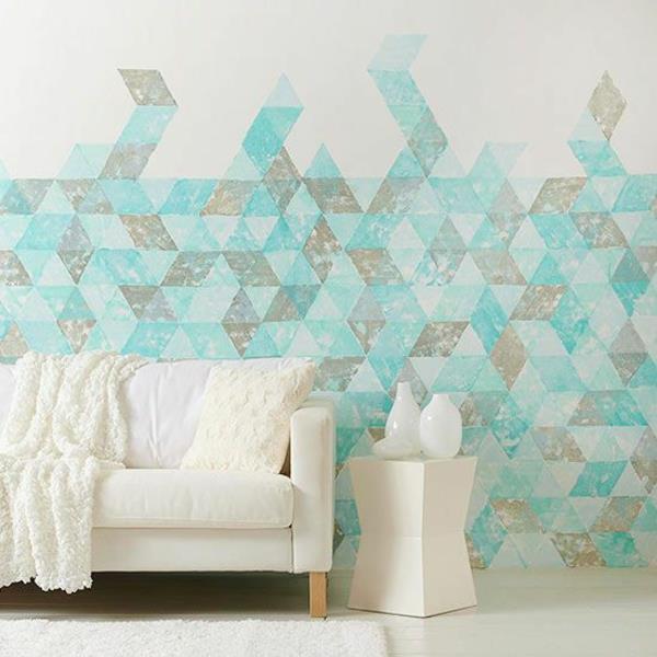 Οι φιγούρες χρώματος τοίχου συνδυάζουν συμπληρωματικά χρώματα του καναπέ