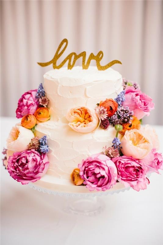 φανταχτερά κέικ για καλοκαιρινό γαμήλιο λευκό κέικ με χρωματιστά λουλούδια