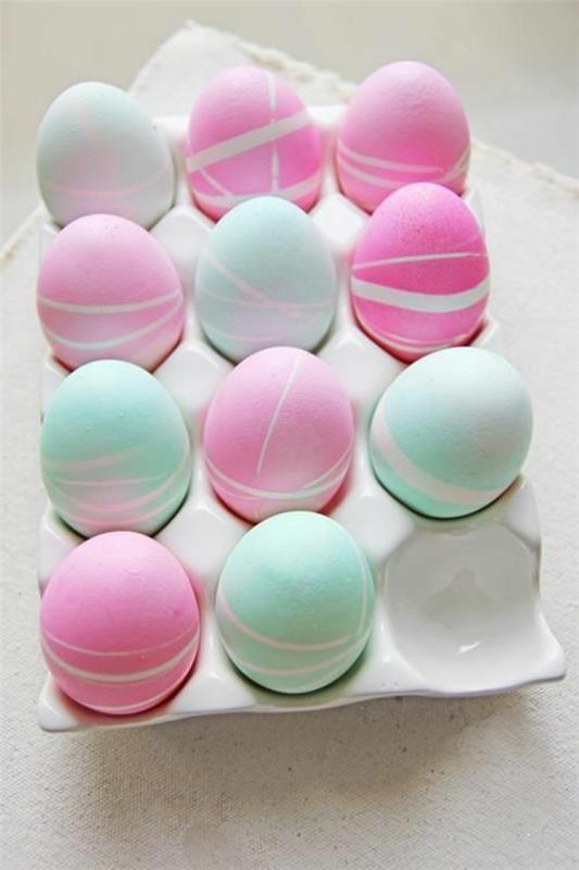 πολύχρωμα Πασχαλινά αυγά ζωγραφίζοντας Πασχαλινά αυγά πράσινο ροζ