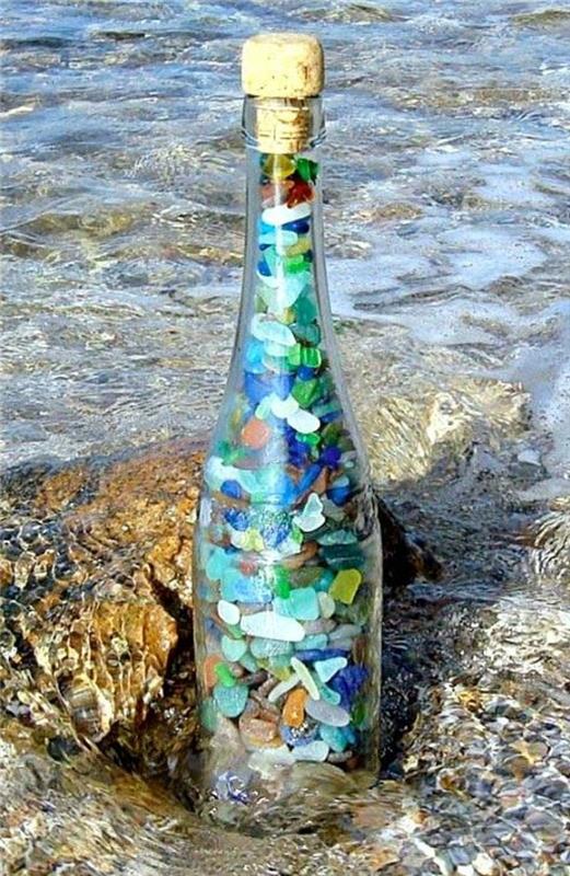 μπουκάλια διακόσμησης γεμίζουν χρωματιστές πέτρες