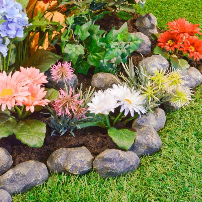 διακοσμητικές πέτρες χρωματιστά λουλούδια κήπου ομορφαίνουν τον κήπο