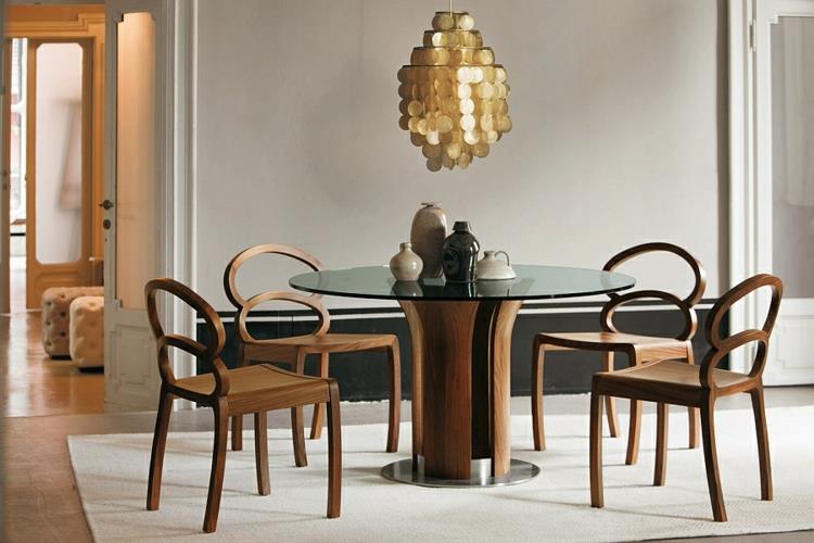 σχεδιαστικά τραπέζια τραπεζαρίας ξύλινες γυάλινες ξύλινες καρέκλες πολυέλαιοι χρυσές πινελιές διακοσμούν κομψά την τραπεζαρία