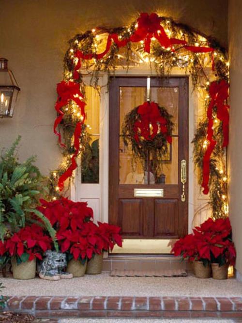 πόρτα εισόδου κόκκινα τόξα γιρλάντες νεράιδα φώτα Χριστούγεννα