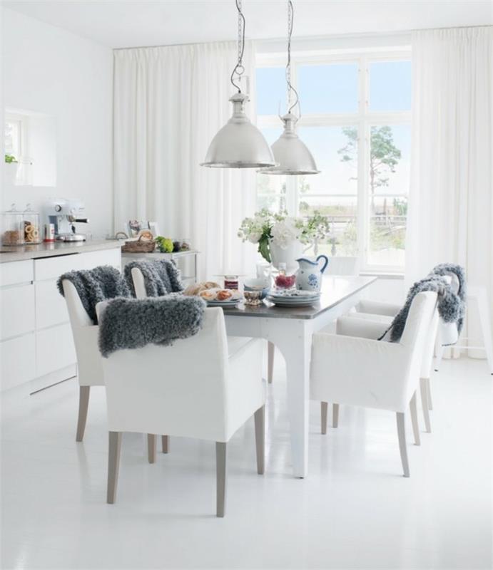 τραπεζαρία μοντέρνο σκανδιναβικό στιλ με λευκές καρέκλες και ωραία διακόσμηση