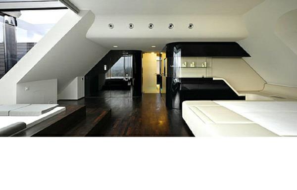 φουτουριστικό υπνοδωμάτιο με κεκλιμένους τοίχους μαύρο λευκό και σκούρο παρκέ