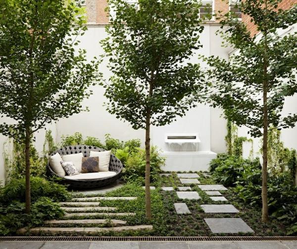 ιδέες σχεδιασμού κήπου πλακόστρωτα δέντρα στρογγυλές πολυθρόνες
