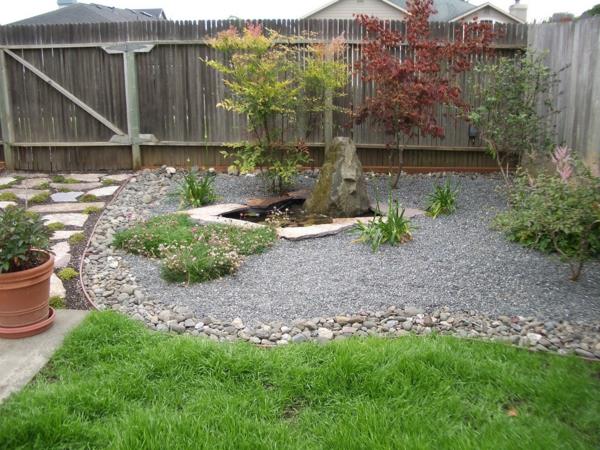 κήπος με πέτρες σχήμα φυτά φράχτη γρασίδι