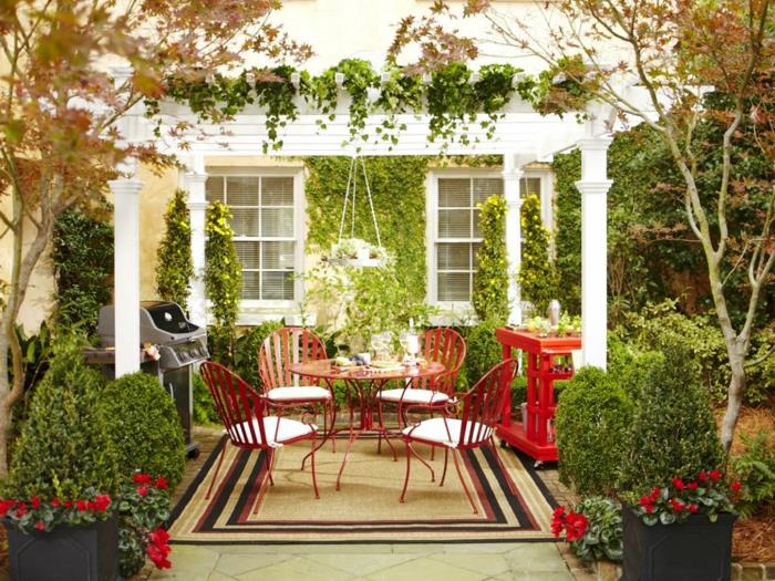 ιδέες σχεδιασμός κήπου στρογγυλό τραπέζι κήπου κόκκινο χαλί φυτών κήπου
