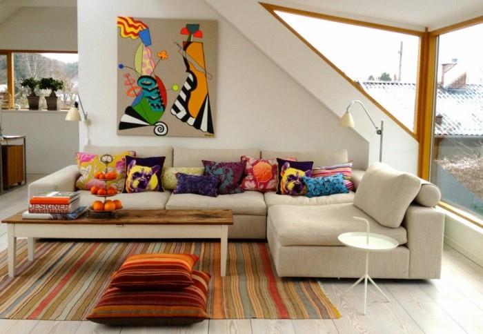 ανακαίνιση σπιτιού διακόσμηση τοίχου σύγχρονη τέχνη γωνιακός καναπές πολύχρωμα ρούχα μαξιλάρια χαλί