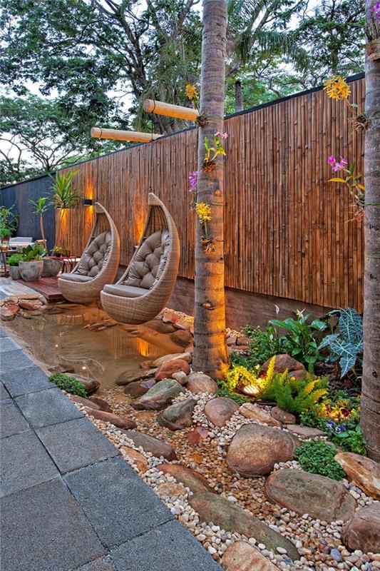 κρεμαστή καρέκλα κήπο μοντέρνες ιδέες σχεδιασμού κήπου πέτρες φωτισμού