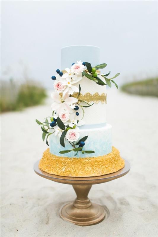 γαμήλιες τούρτες γαλάζια βαθμιδωτή τούρτα με μεγάλα λουλούδια