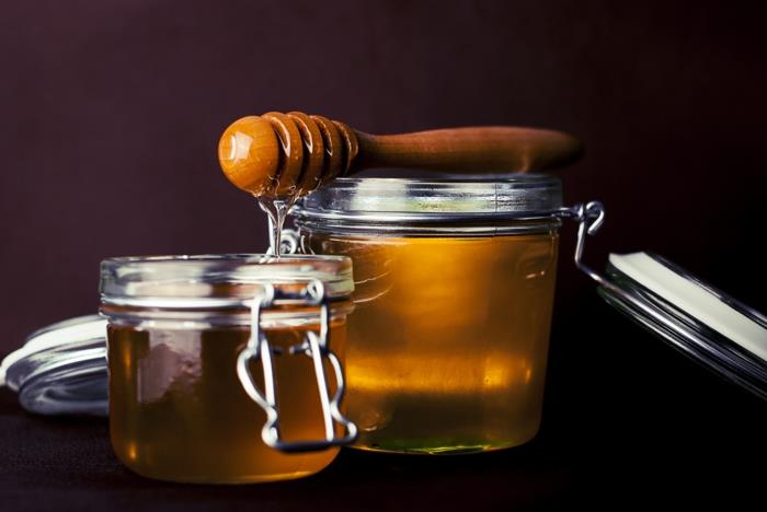 μέλι υγιεινό δοχείο μελιού κουτάλι μέλι κηρήθρα μαύρο