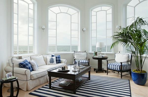 εσωτερική διακόσμηση σαλόνι μπλε και λευκό παράθυρο καναπέ χαλί