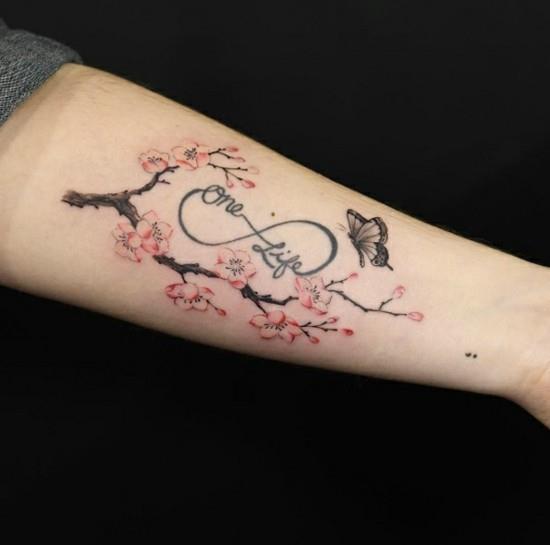 κερασιά τατουάζ με άπειρο σύμβολο αντιβράχιο