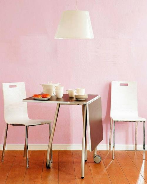 Πτυσσόμενο τραπέζι στην κουζίνα ιδέα μεταλλικό υλικό ροζ τοίχος