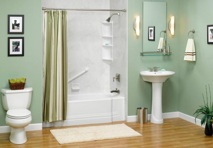Μικρό μπάνιο με ενσωματωμένη μπανιέρα ορθογώνια πράσινη παστέλ βαφή τοίχου