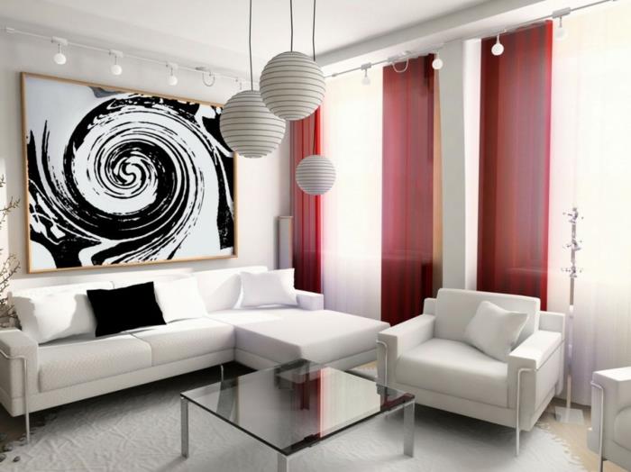 μικρό σαλόνι επιπλωμένο λευκό καναπέ πολυθρόνα στρογγυλά κρεμαστά φώτα τέχνη τοίχου