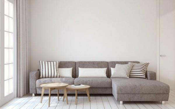 Σκανδιναβική επίπλωση με επικαλυμμένο καναπέ και στρογγυλά τραπεζάκια καφέ