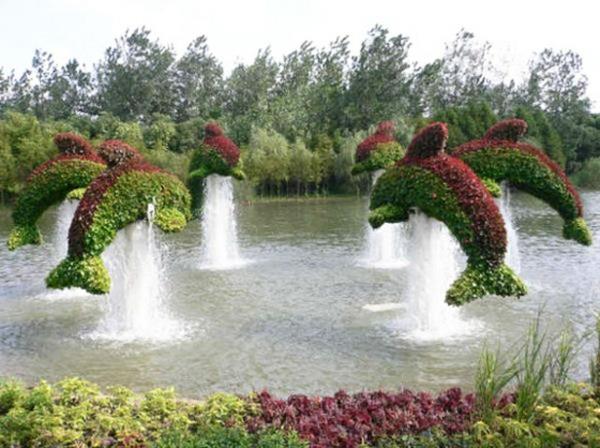 τοπίο γλυπτά κήπου των χαρακτήρων κινουμένων σχεδίων νερό φυτό