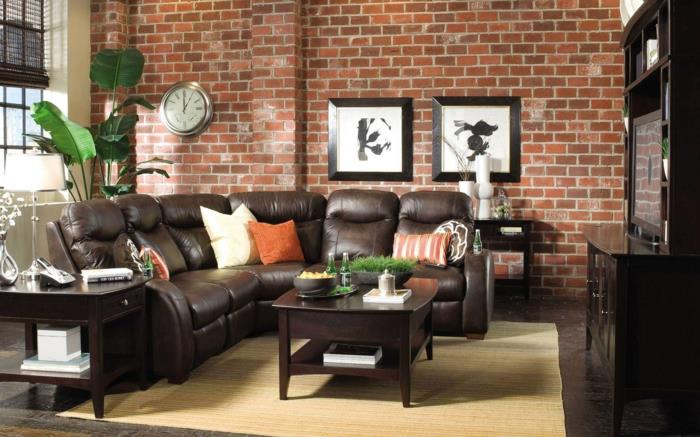 δερμάτινος καναπές πραγματικό δέρμα σκούρο καφέ τοίχο από τούβλα