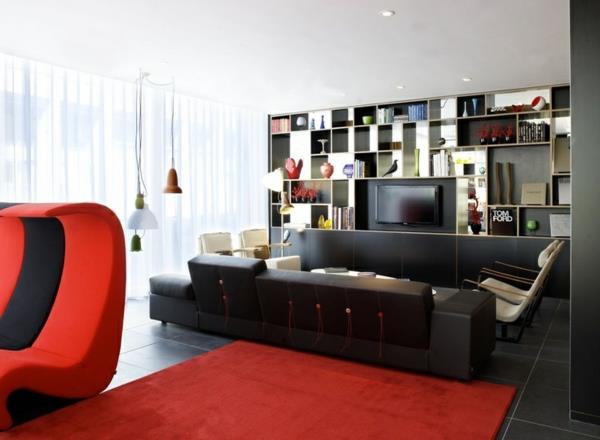 πολυτελές σαλόνι μαύρος καναπές κόκκινο χαλί ντουλάπα καρέκλα