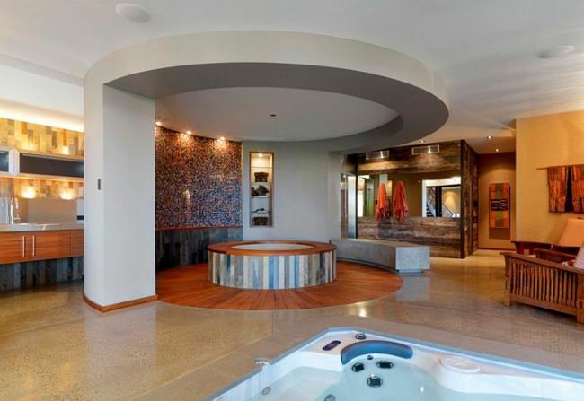 πολυτελής μπανιέρα ευεξίας στο σπίτι με υδρομασάζ γύρω από το σαλόνι