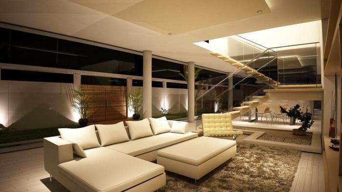 μοντέρνο σαλόνι τεράστιος καναπές και αξιοπρεπής διακόσμηση