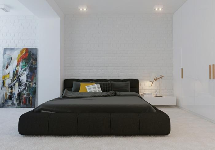 μειωμένο σαλόνι διπλό κρεβάτι υπνοδωμάτιο λευκός τοίχος από τούβλα