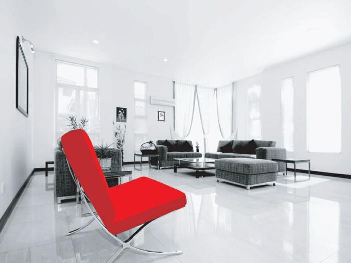 κόκκινη πολυθρόνα με έμφαση στο σαλόνι