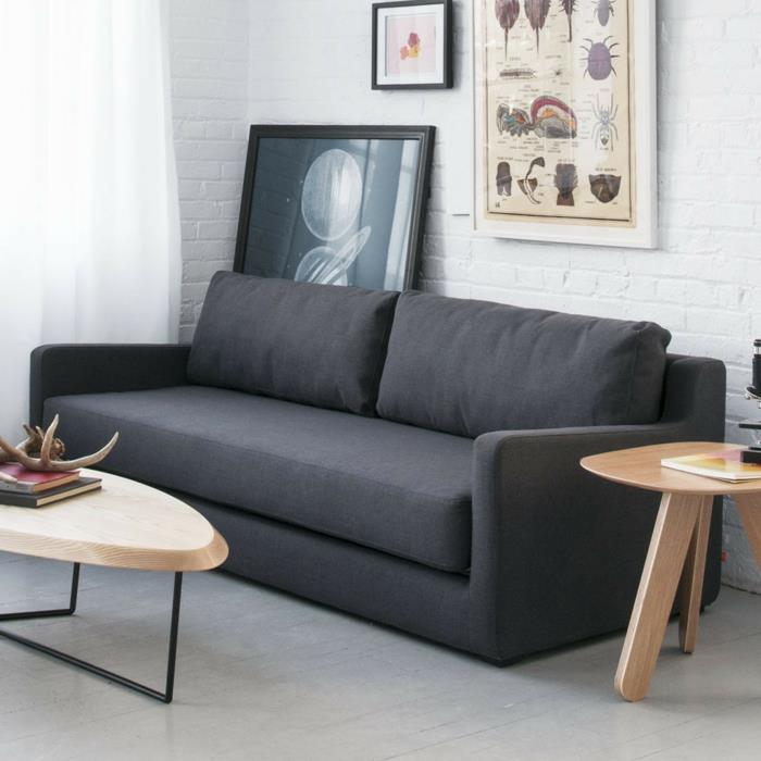καναπέδες -κρεβάτια σαλόνι μαύρος καναπές κομψό σαλόνι με λευκό τοίχο από τούβλα