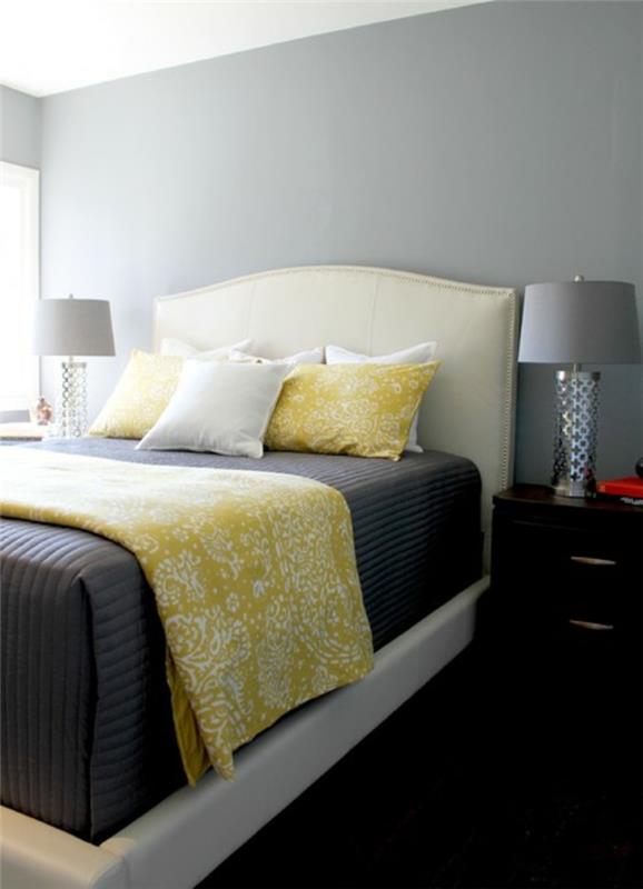 ιδέες διακόσμησης κρεβατοκάμαρας κίτρινες πινελιές ρίχνουν μαξιλάρια σκούρο πάτωμα
