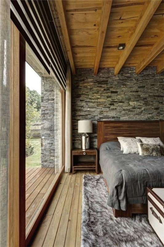 υπνοδωμάτιο σχεδιασμός ρουστίκ εσωτερική επίπλωση ξύλινο κρεβάτι πλαίσιο πέτρινος τοίχος