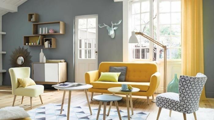 Σκανδιναβικό σαλόνι κίτρινος καναπές στρογγυλά πλευρικά τραπεζάκια γεωμετρικό χαλί