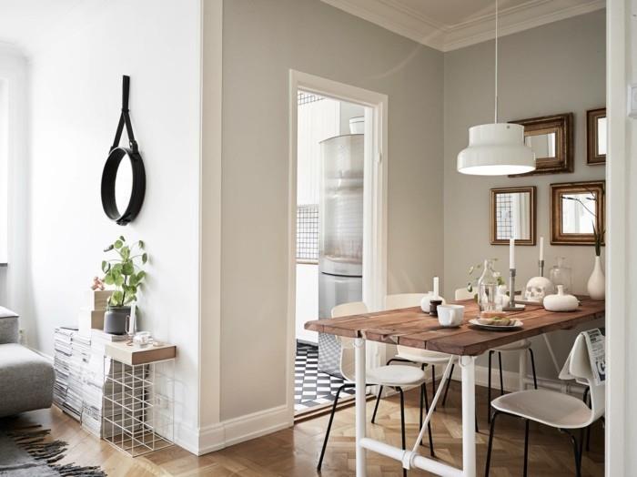 Σκανδιναβικός σχεδιασμός στην τραπεζαρία ξύλινο τραπέζι και άνετες λευκές καρέκλες