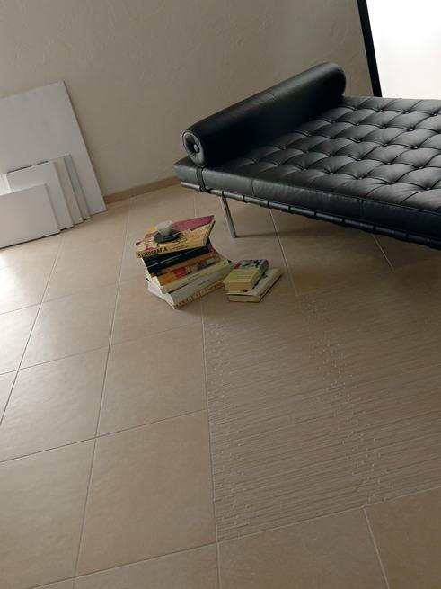 tableau zona giorno βιβλία καναπέ cerdomus