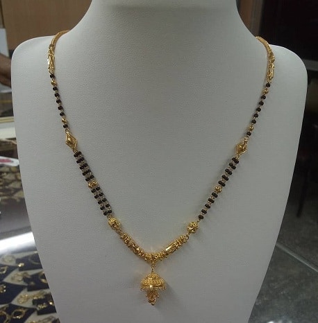Dirbtinis trumpas mangalsutros dizainas